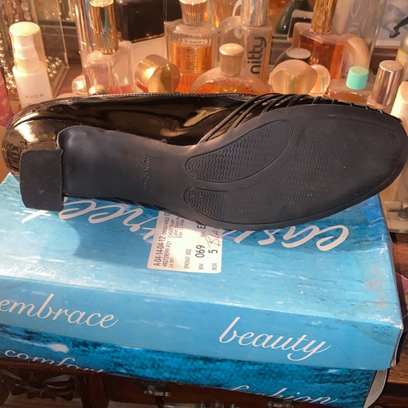 Cagey pump. 2 inch heel. Black Patent leather. 12 wide. Lightly used. - Picture 3 of 3